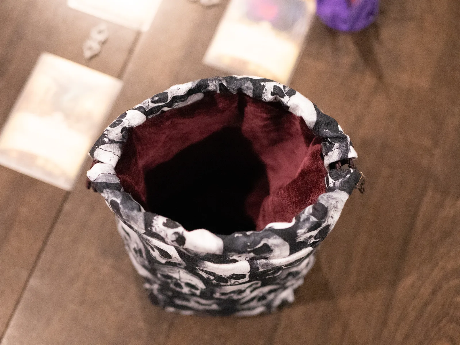 The same bag open from above, showing its deep red satin lining